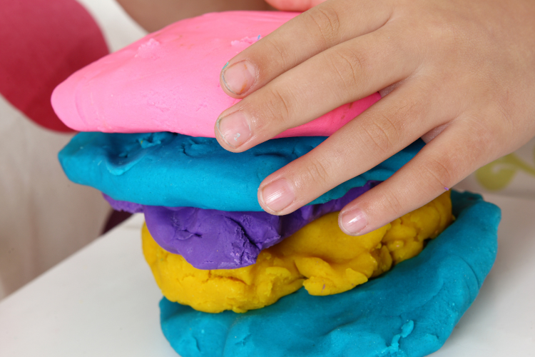 Play doh is a great tactile sensory toy used in occupational therapy. View our list of sensory toys!